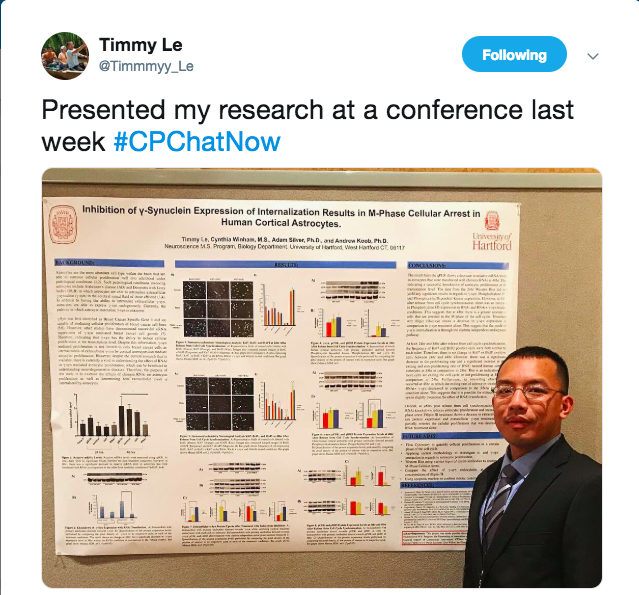 Timmy tweeted about presenting his latest research at a conference. There is an image of Timmy presenting at a conference.