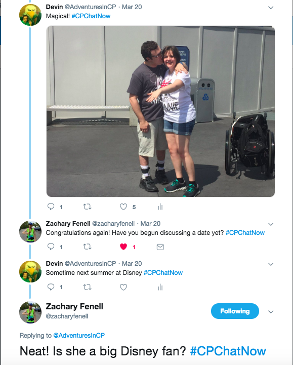 Zach asked me how my vacation was. i replied with magical with a picture of my fiancee showing off her engagement ring. i am in a gray shirt with mickey mouse on it and she is in a white minnie mouse shirt