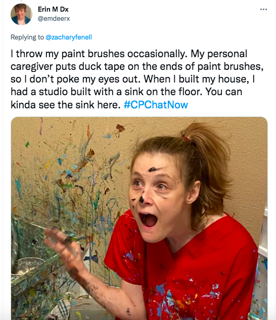 erin tweets she throws her pain brushes occasionally. her personal caregiver puts duck tape on the ends of her brushes and she had a studio built with a sink in the floor. an image of erin with a red shirt and paint splotches 